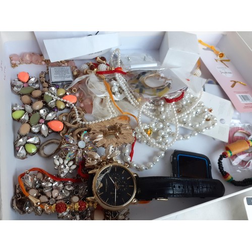 439 - A BOX OF COSTUME JEWELLERY