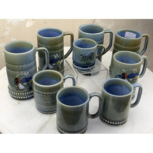 457 - A LOT OF 9 IRISH PORCELAIN TANKARDS