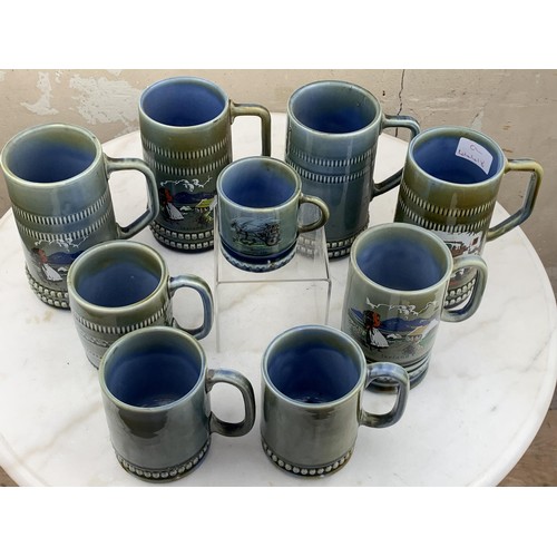 457 - A LOT OF 9 IRISH PORCELAIN TANKARDS