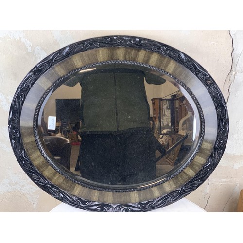 463 - OVAL FRAMED MIRROR 25 X 21