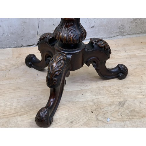 491 - A VICTORIAN REEDED COLUMN TORCHERE TO A HEAVILY CARVED BASE