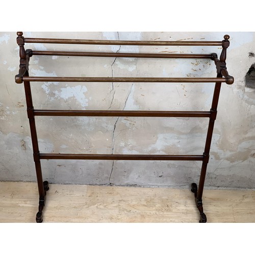 528 - A TALL VICTORIAN TOWEL RAIL WITH A TRIPLE TOP