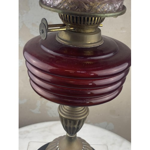 487 - A RUBY BOWL OIL LAMP WITH A RUBY TIPPED SHADE