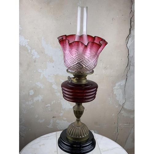 487 - A RUBY BOWL OIL LAMP WITH A RUBY TIPPED SHADE