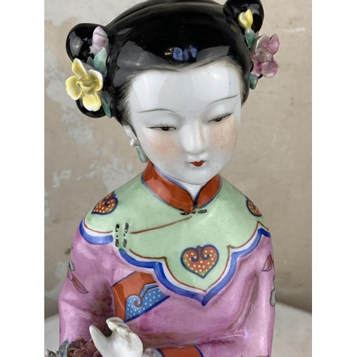 180A - A CHINESE PORCELAIN LADY 17