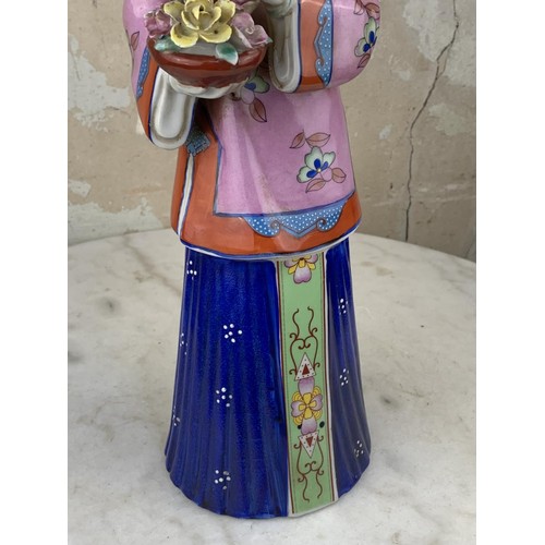 180A - A CHINESE PORCELAIN LADY 17