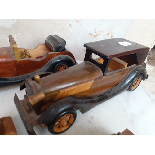 57 - 4 VINTAGE HAND CRAFTED WOODEN CARS