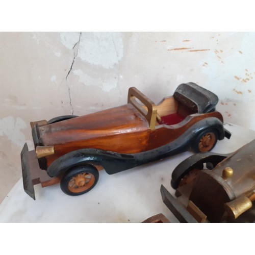 57 - 4 VINTAGE HAND CRAFTED WOODEN CARS