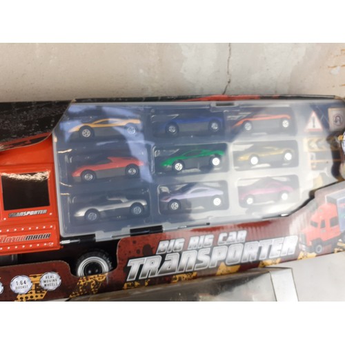 132 - BOXED CAR TRANSPORTER & BOXED F1 CAR