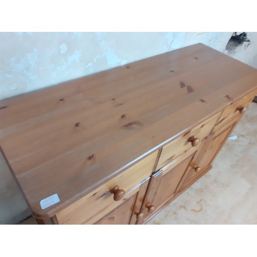 136 - A 3 DRAWERED 3 DOOR SIDEBOARD