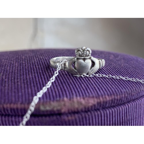 241 - A SILVER CLADDAGH RING ON A SILVER CHAIN