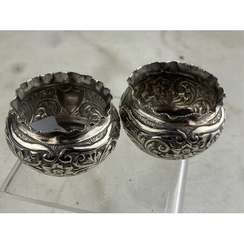 253 - A PAIR OF BIRMINGHAM SILVER EMBOSSED SALTS 44.7grms