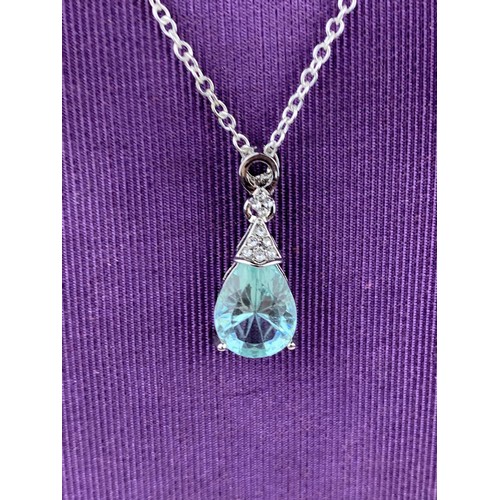 255 - TOPAZ STYLE PENDANT ON A SILVER CHAIN