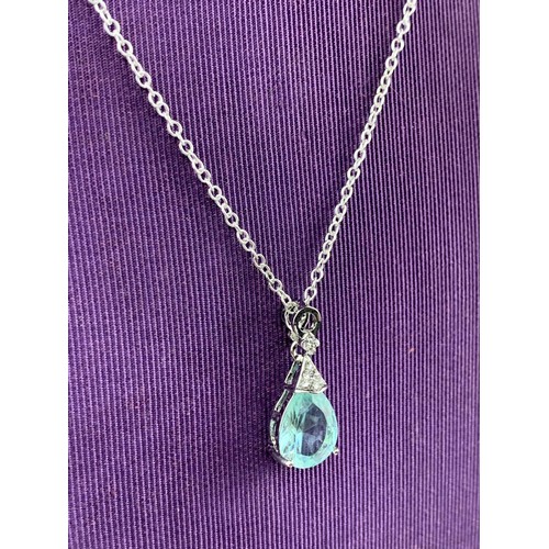 255 - TOPAZ STYLE PENDANT ON A SILVER CHAIN