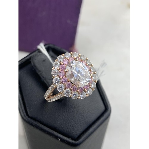 256 - A SILVER GILT CZ & PINK SAPPHIRE RING