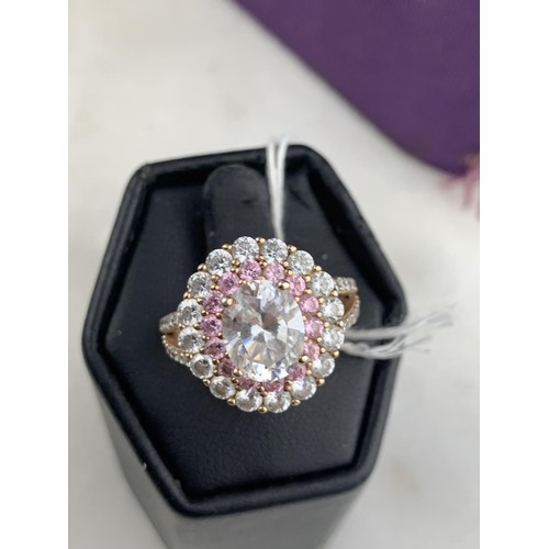 256 - A SILVER GILT CZ & PINK SAPPHIRE RING