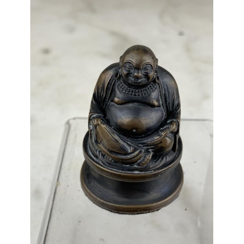 258 - A MINIATURE BRONZE BUDDHA