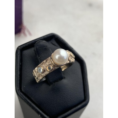 259 - A BOXED HEAVY SILVER PEARL & CRYSTAL RING