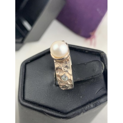 259 - A BOXED HEAVY SILVER PEARL & CRYSTAL RING