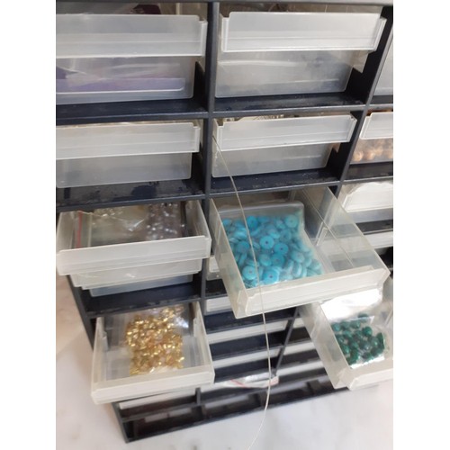 309 - STORAGE UNIT WITH CONTENTS (BEADS)