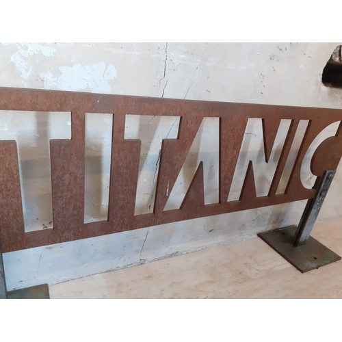 312 - TITANIC METAL SIGN ON STAND