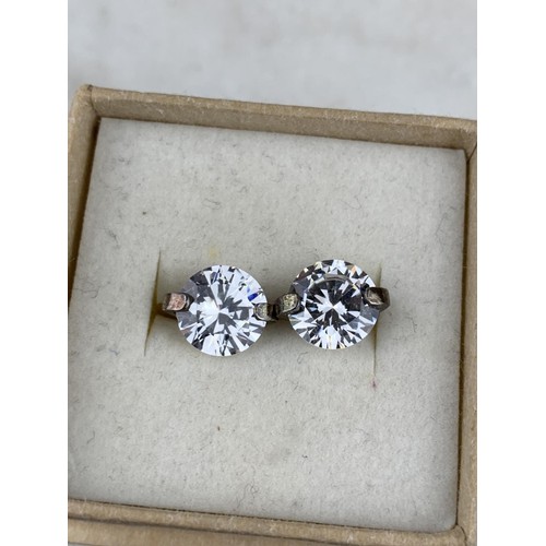 432 - A SILVER SET GEM SET SOLITAIRE EARRINGS