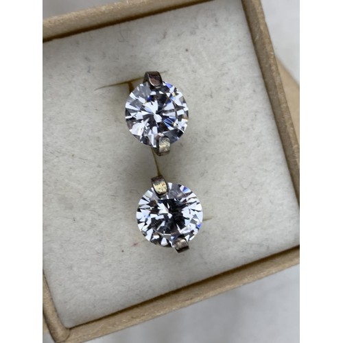 432 - A SILVER SET GEM SET SOLITAIRE EARRINGS