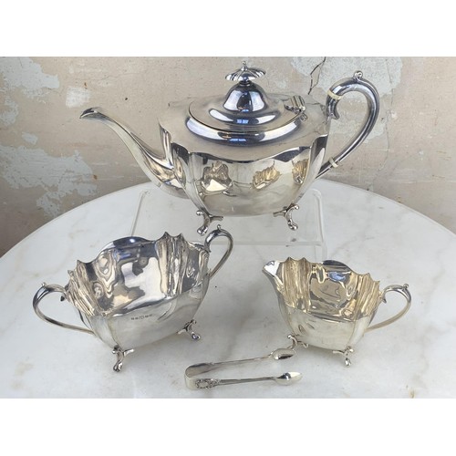 486 - A 3 PIECE SILVER PLATED TEA SET & MATCHING SUGAR TONGS