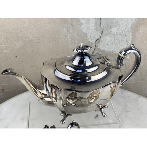 486 - A 3 PIECE SILVER PLATED TEA SET & MATCHING SUGAR TONGS