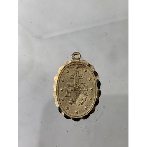 445 - A 9CT GOLD RELIGIOUS PENDANT 2.7G