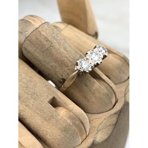 447 - A 3 STONE DIAMOND ILLUSION RING WITH 18ct GOLD STAMP AND PLATINUM SETTING TOTAL WEIGHT 3.9grms