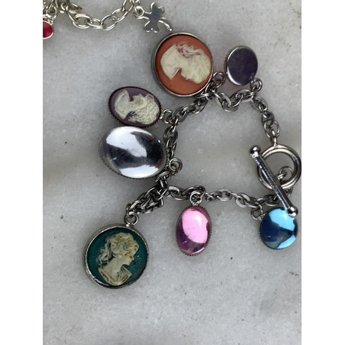 611 - 2 ASSORTED CHARM BRACELETS