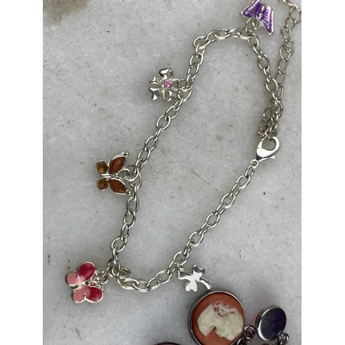 611 - 2 ASSORTED CHARM BRACELETS