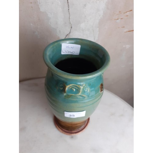 35 - A GLAZED POTTERY VASE 8