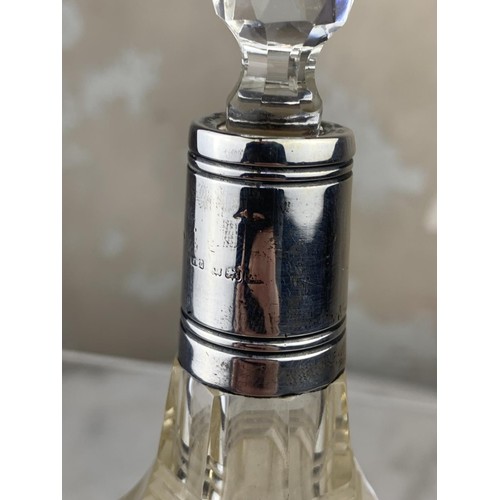 589 - SILVER TOPPED PERFUME BOTTLE 5.5