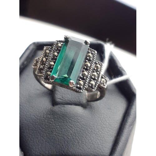 643 - A GREEN STONE SILVER & MARCASITE RING