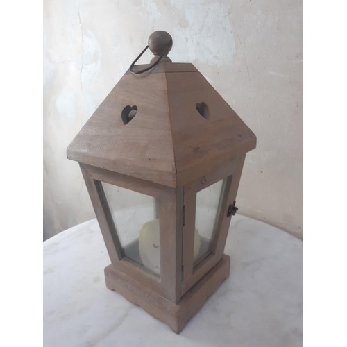 634 - A WOODEN LANTERN 16