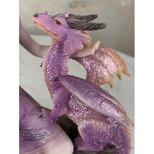 582 - A PAURPLE FAIRY & DRAGON FIGURINE