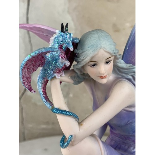 615 - A BLUE FAIRY & DRAGON FIGURINE