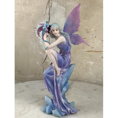 615 - A BLUE FAIRY & DRAGON FIGURINE