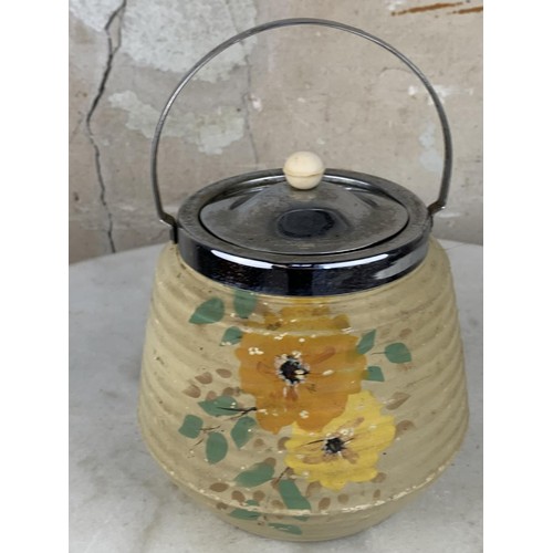 638A - A HANDPAINTED BISCUIT BARRELL WITH A PLATED TOP