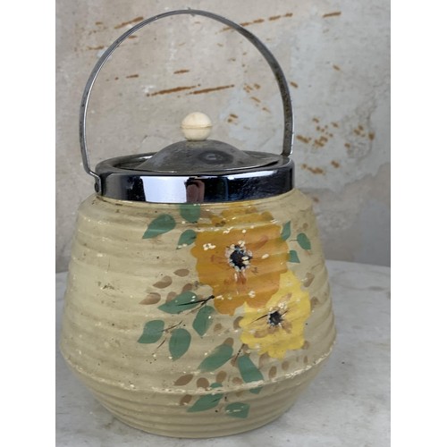 638A - A HANDPAINTED BISCUIT BARRELL WITH A PLATED TOP