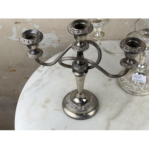 22 - A PAIR OF PLATED CANDLELABRA & A PAIR OF PLATED CANDLESTICKS