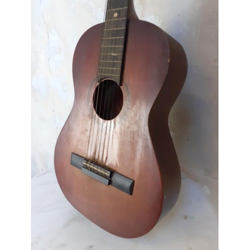 27 - AN ACOUSTIC GUITAR