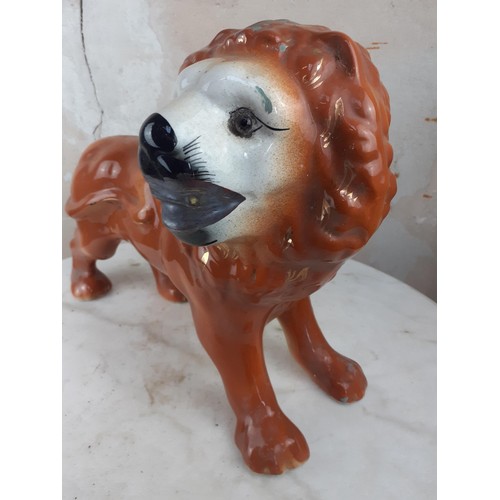 100 - A STAFFORDSHIRE POTTERY LION 11 x 14