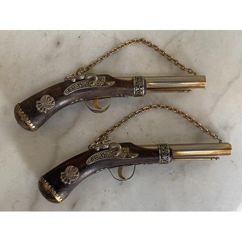 117 - A PAIR OF WALL MOUNT DUALING PISTOL