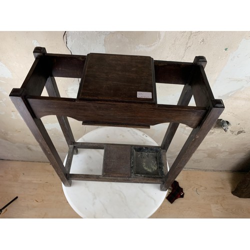 136 - A SMALL OAK STICKSTAND WITH STORAGE 21 x 9 x 26