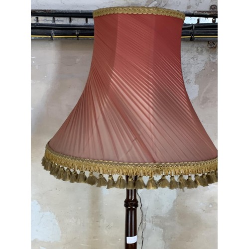 166 - A MAHOAGNY STANDARD LAMP COMPLETE WITH SHADE