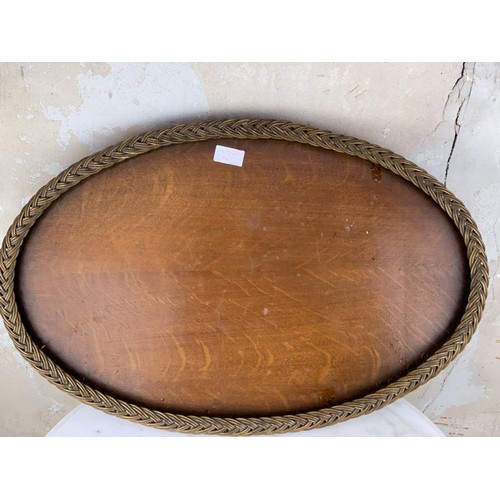 186 - A WICKER OVAL WOVEN EDGED TRAY 25 x 16”