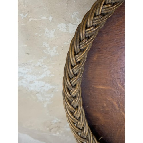 186 - A WICKER OVAL WOVEN EDGED TRAY 25 x 16”